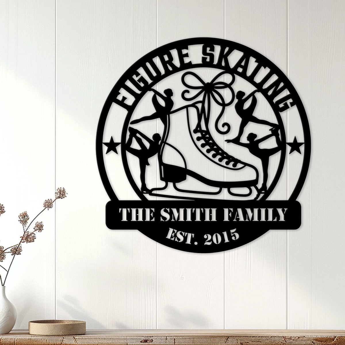 Family figure skating metal sign displayed as wall decor on a light wood-paneled wall