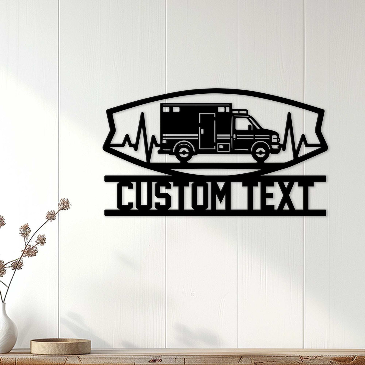 Ambulance wall decor displayed on a light wood wall, featuring an emergency vehicle and heartbeat graphic