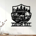 Ambulance wall decor displayed on a light wood-paneled wall above a console table