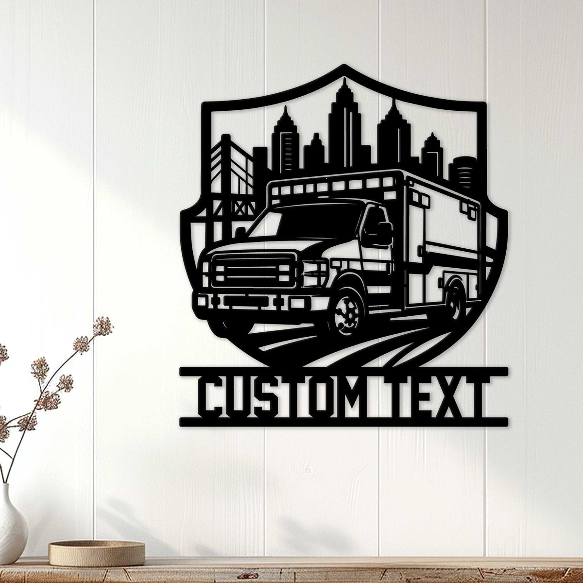 Ambulance wall decor displayed on a light wood-paneled wall above a console table