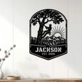 Arborist wall sign displayed on a white paneled wall, featuring a tree climber and mountain sunrise scene