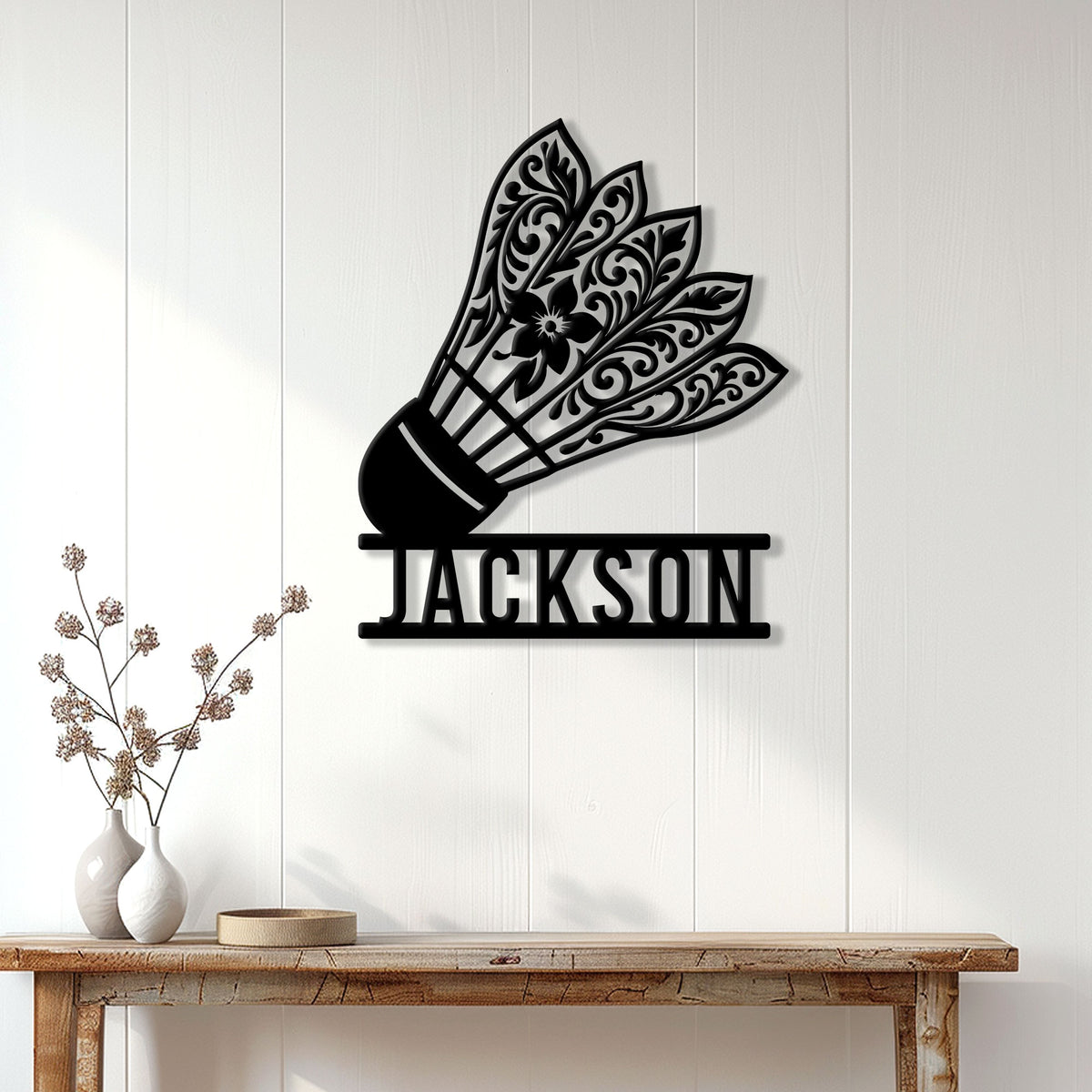 Badminton shuttlecock wall sign displayed on a bright paneled wall above a console table
