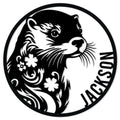 Black and white otter portrait metal sign with floral details in a round wall decor design