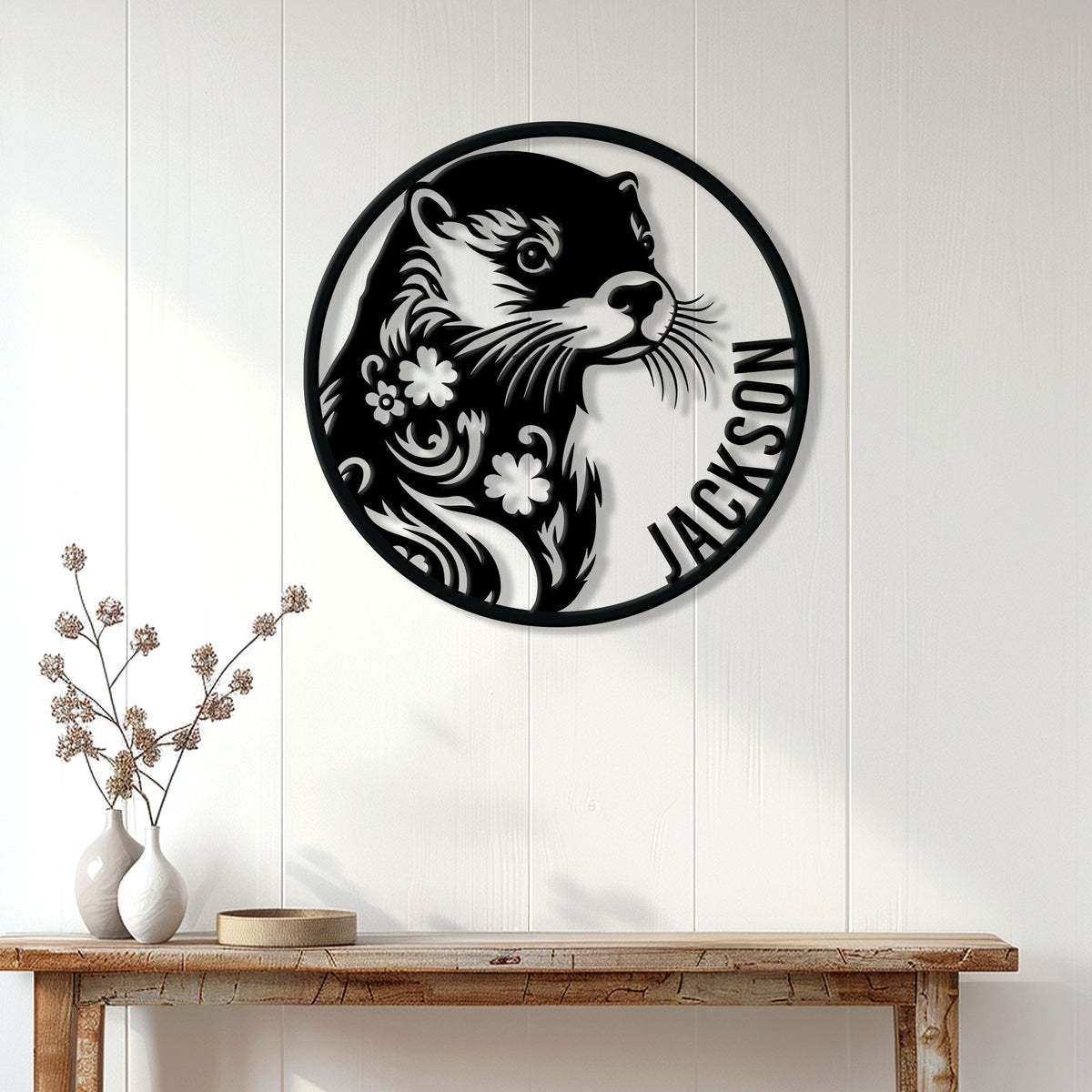 Custom otter metal sign displayed on a white paneled wall above a rustic console table