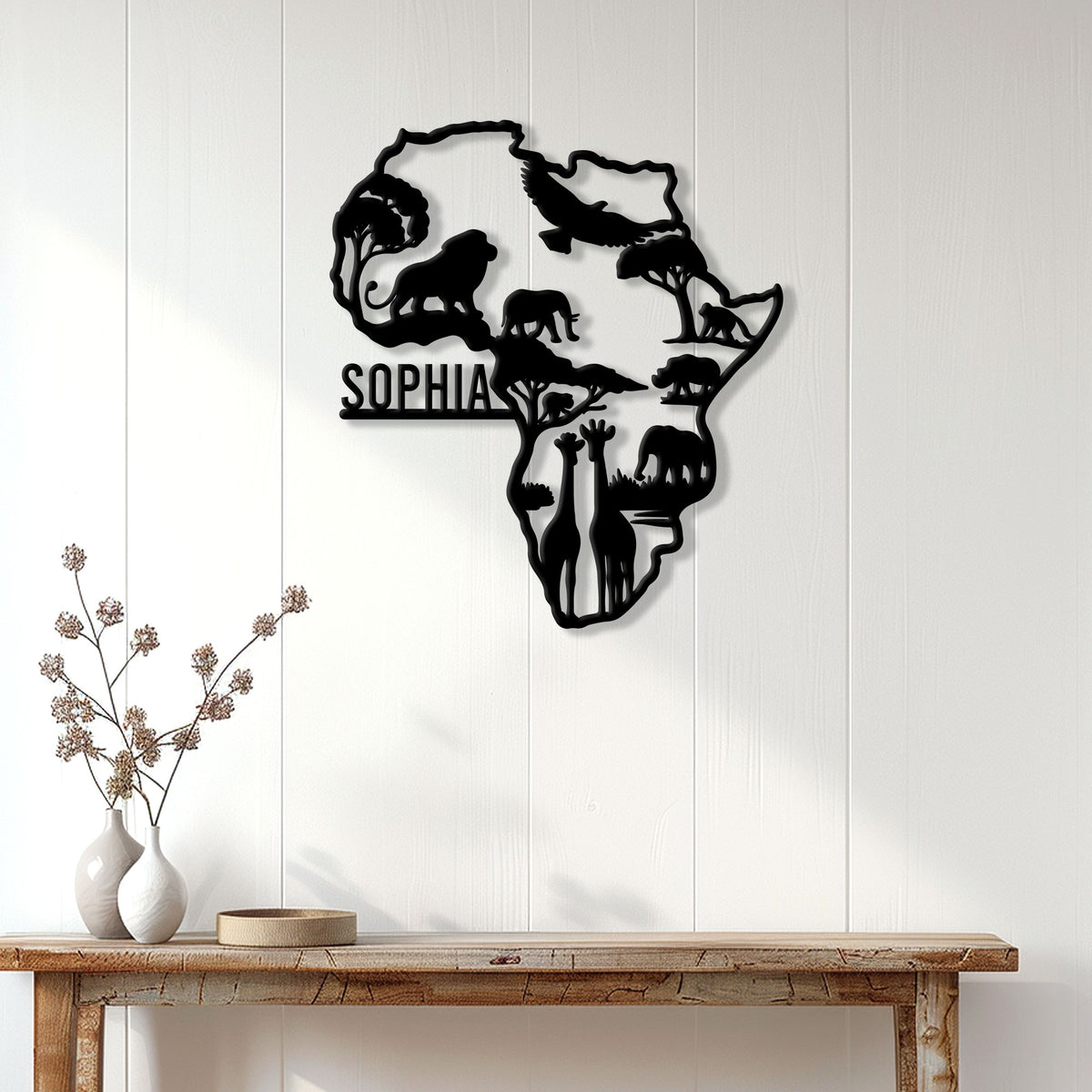 African wildlife wall sign displayed above a console table, featuring safari animals and acacia tree silhouettes