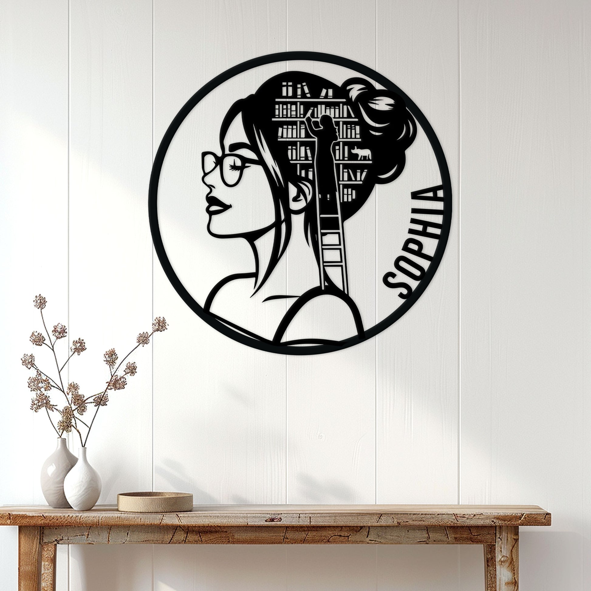Book lover metal wall sign displayed above a wood console in a bright reading-inspired home interior