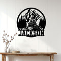 Snowmobile wall decor displayed above a wood console, featuring a mountain, pine forest, and rider silhouette