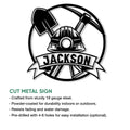 Miner cut metal sign artwork with a hard hat, pickaxe, shovel, and circular industrial emblem