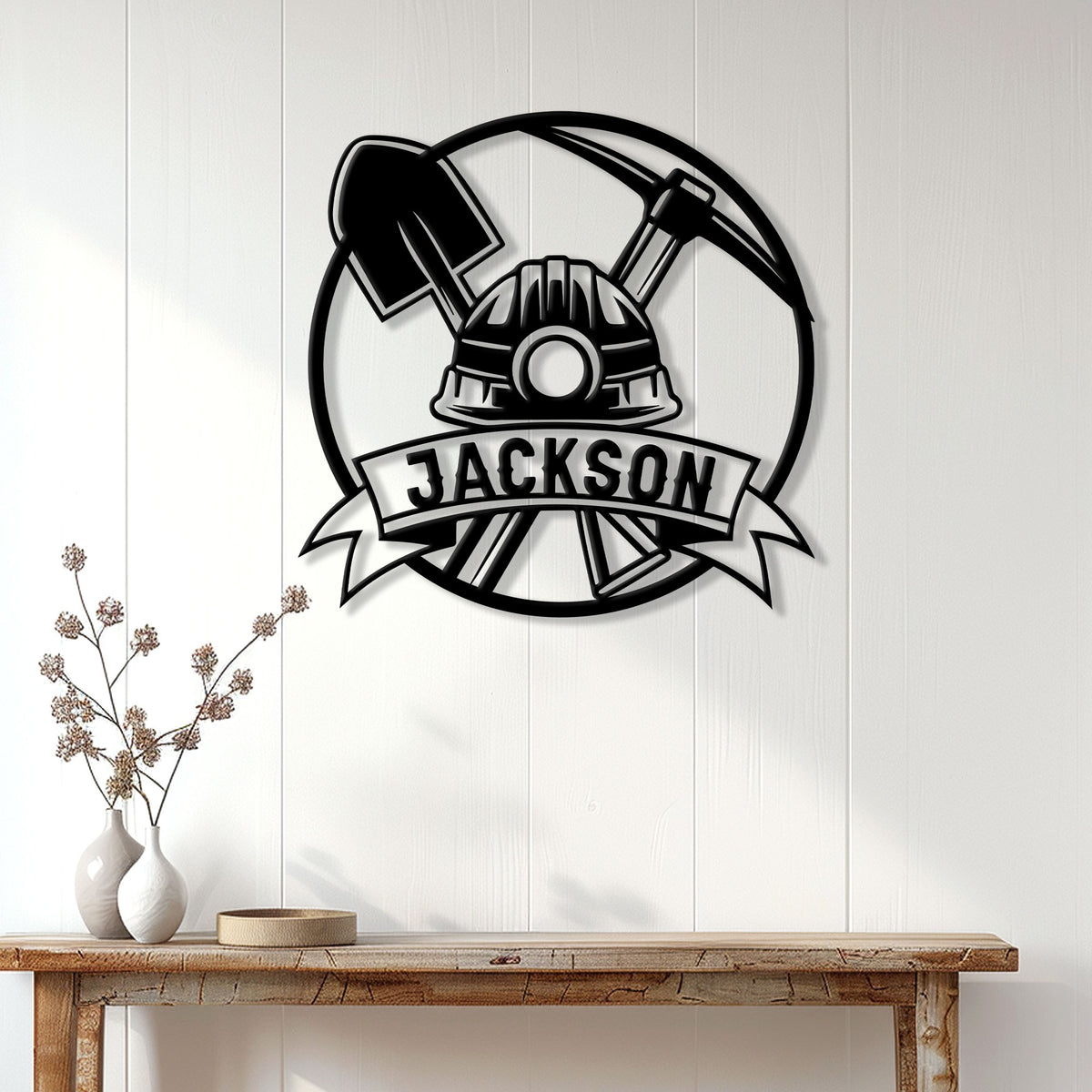Miner metal wall sign displayed above a console table in a bright modern entryway