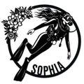 Custom scuba diving metal sign featuring a scuba diver in fins and mask framed by a floral wreath