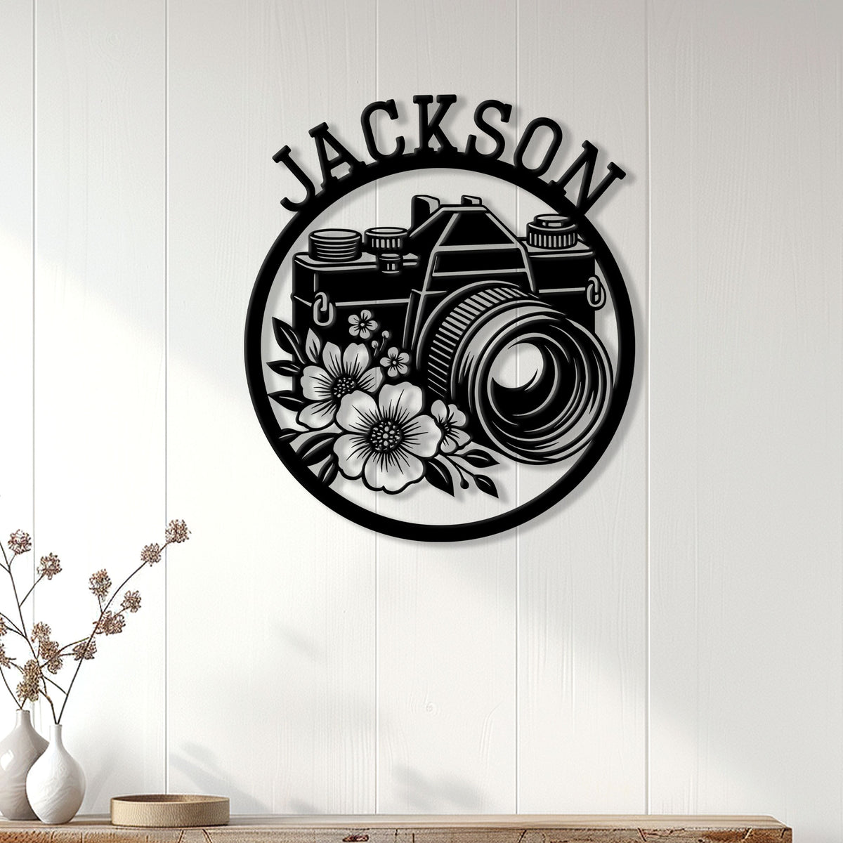 Floral camera wall sign displayed as photography decor on a bright paneled interior wall