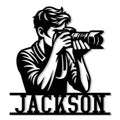 Custom photographer metal sign featuring a bold black silhouette of a camera operator with a large lens