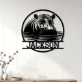 Hippo metal wall decor displayed on a light paneled wall above a console table