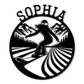Black metal sign featuring a snowboarder carving through a mountain landscape with pine trees and bold lettering