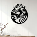 Snowboarder wall sign displayed on a white paneled wall above a console table in a modern room