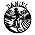Circular snowboarding metal sign featuring a snowboarder carving through mountain peaks and pine trees