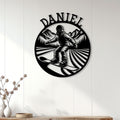 Snowboarding wall decor displayed on a white paneled wall above a console table