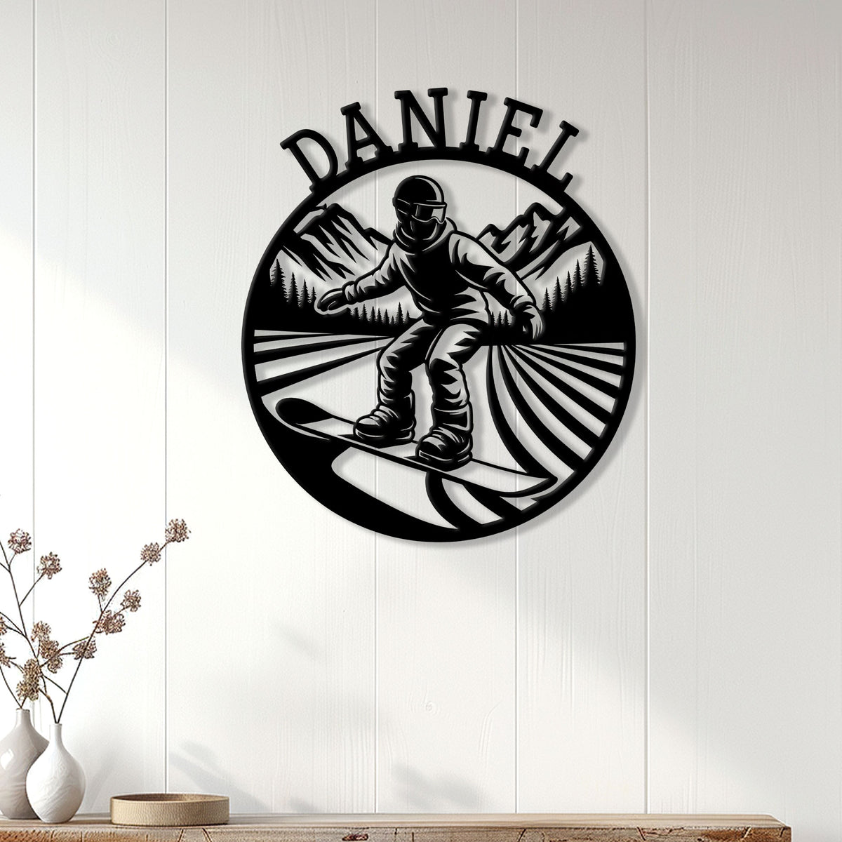Snowboarding wall decor displayed on a white paneled wall above a console table