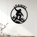 Snowboarding wall decor displayed on white paneled walls above a console in a bright home