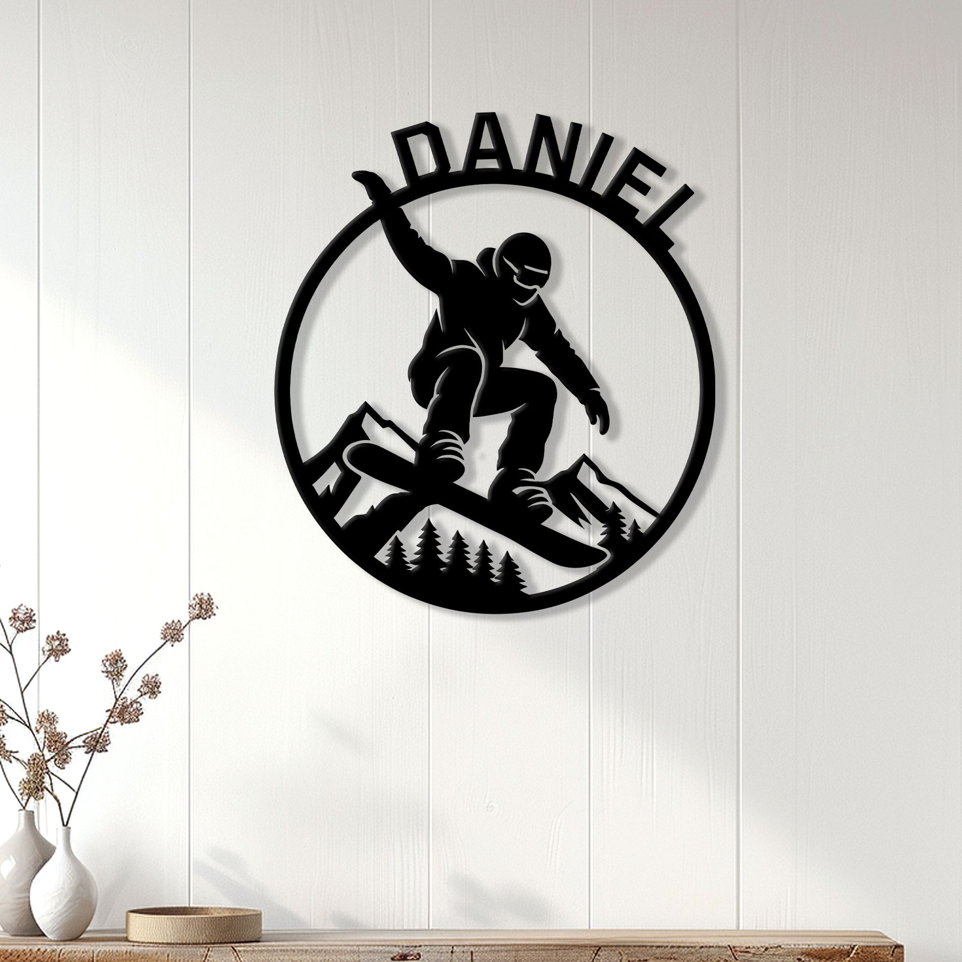 Snowboarding wall decor displayed on white paneled walls above a console in a bright home