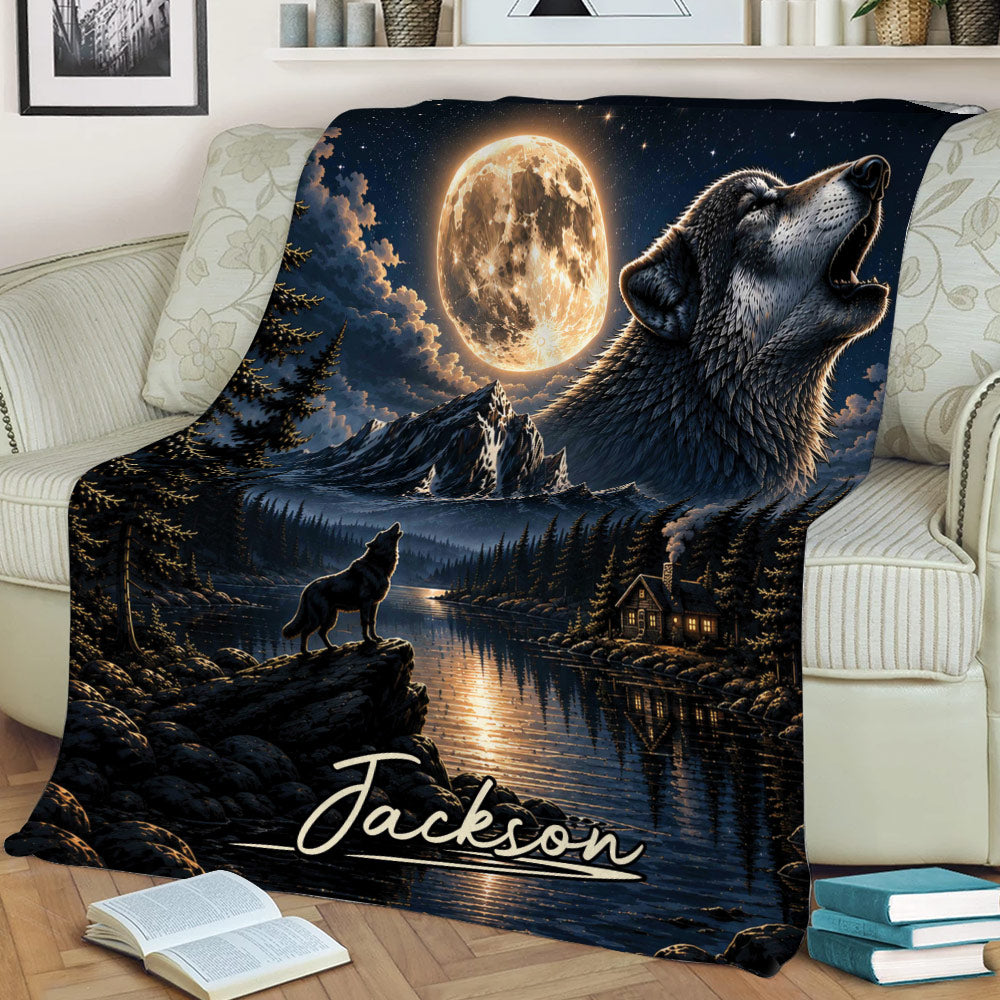 Wolf throw blanket displayed on a sofa with full moon, mountain lake, forest, and cabin scene