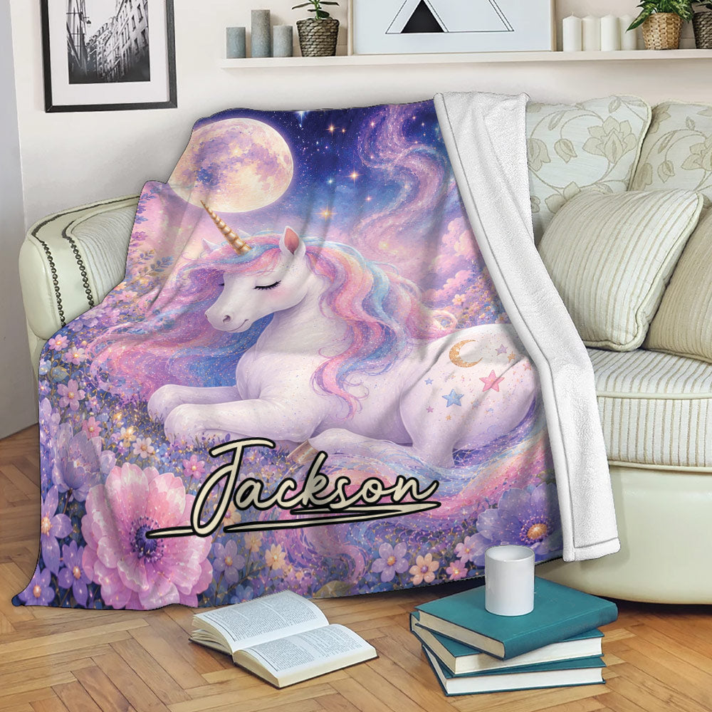 Custom unicorn blanket displayed on a sofa with pastel flowers, moonlit stars, and colorful fantasy artwork