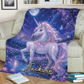 Close lifestyle view of a unicorn blanket featuring a lavender mane, starry sky, lake, and lotus flowers
