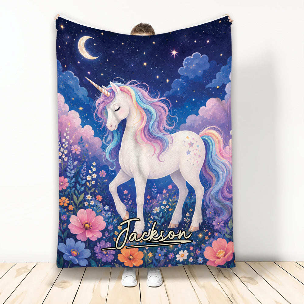 Unicorn throw blanket with pastel rainbow mane, flowers, stars, crescent moon, and magical night-sky artwork