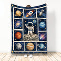 Astronaut throw blanket with planets, rocket, satellite, stars, and space explorer artwork