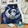 Astronaut throw blanket displayed on a sofa with moon, rocket, stars, and galaxy artwork