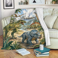 Dinosaur blanket draped over a sofa with colorful prehistoric artwork and tropical jungle scenery