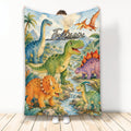 Colorful dinosaur blanket displayed upright with jungle scenery, a river, palm trees and multiple prehistoric creatures