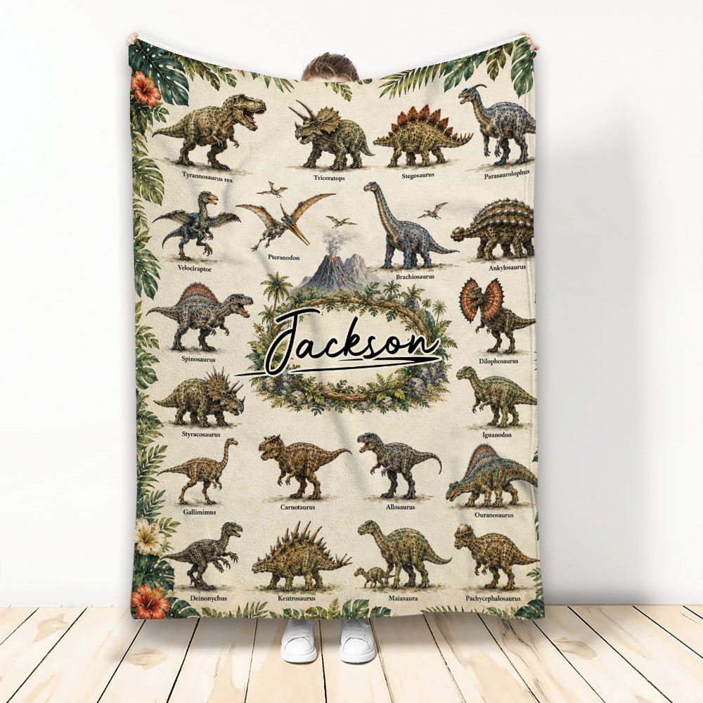 Dinosaur throw blanket displayed upright with illustrated dinosaurs, tropical leaves, volcano scenery, and custom central design