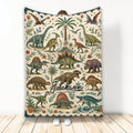 Dinosaur throw blanket displayed upright with vintage prehistoric artwork, tropical plants, flowers, and flying reptiles