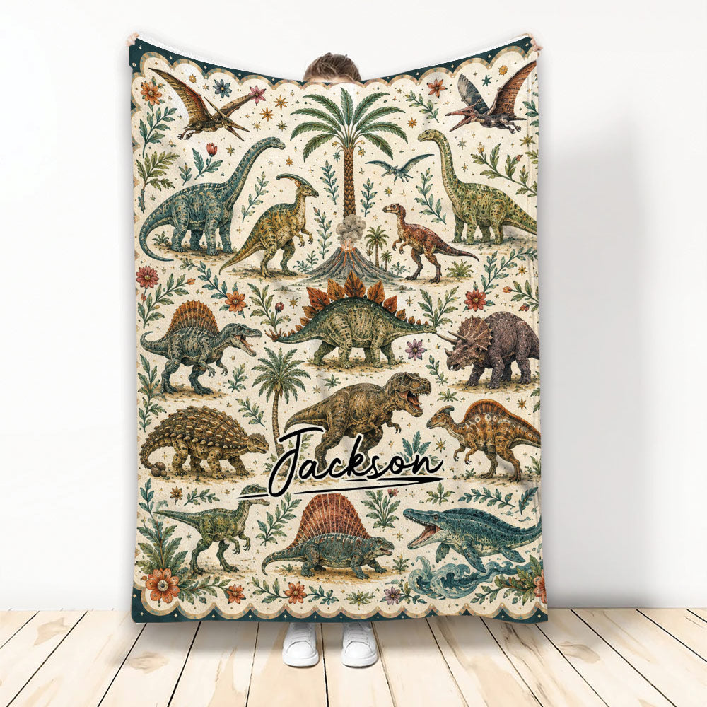 Dinosaur throw blanket displayed upright with vintage prehistoric artwork, tropical plants, flowers, and flying reptiles