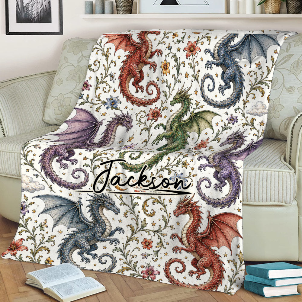 Fantasy dragon blanket styled across a sofa with detailed red, blue, green, and purple dragon artwork