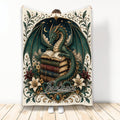 Ornate dragon blanket featuring a winged green dragon resting on antique books beneath a starry night sky