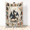 Dragon blanket with a moonlit winged dragon, vintage books, botanical details, and a warm fantasy design