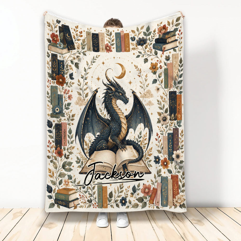 Dragon blanket with a moonlit winged dragon, vintage books, botanical details, and a warm fantasy design