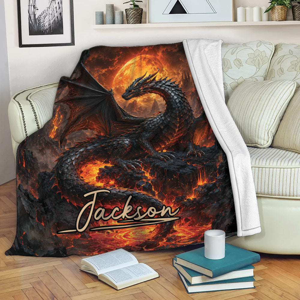 Dragon throw blanket draped over a sofa with black scales, orange lava, and dramatic fantasy artwork