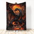 Dark dragon blanket displayed upright with fiery volcano artwork, glowing moon, and fantasy castle background
