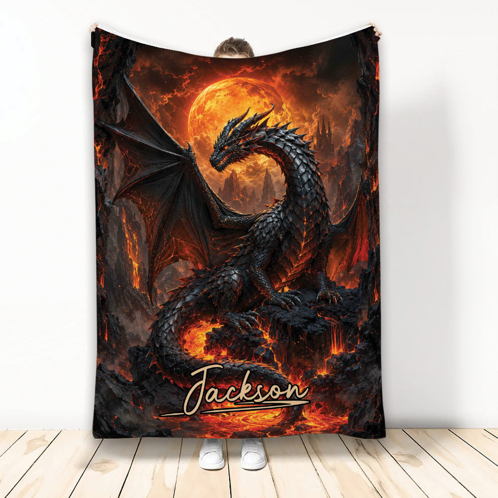 Dark dragon blanket displayed upright with fiery volcano artwork, glowing moon, and fantasy castle background