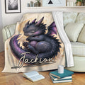 Dragon throw blanket draped over a sofa with a cozy sleeping fantasy dragon and celestial star design