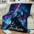 Fantasy dragon throw blanket displayed on a sofa with a glowing galaxy and mountain landscape