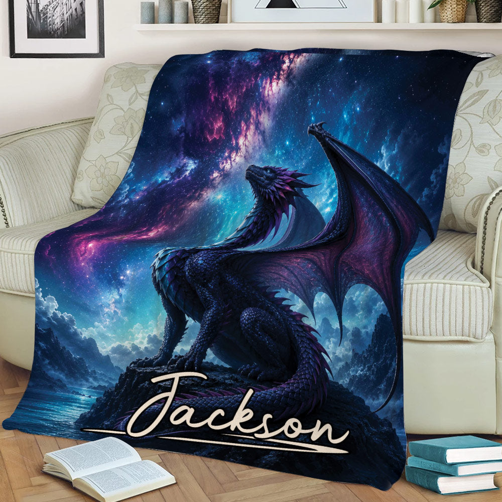 Fantasy dragon throw blanket displayed on a sofa with a glowing galaxy and mountain landscape