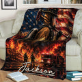 Firefighter blanket displayed on a couch with fire truck, rescue scene, and patriotic artwork