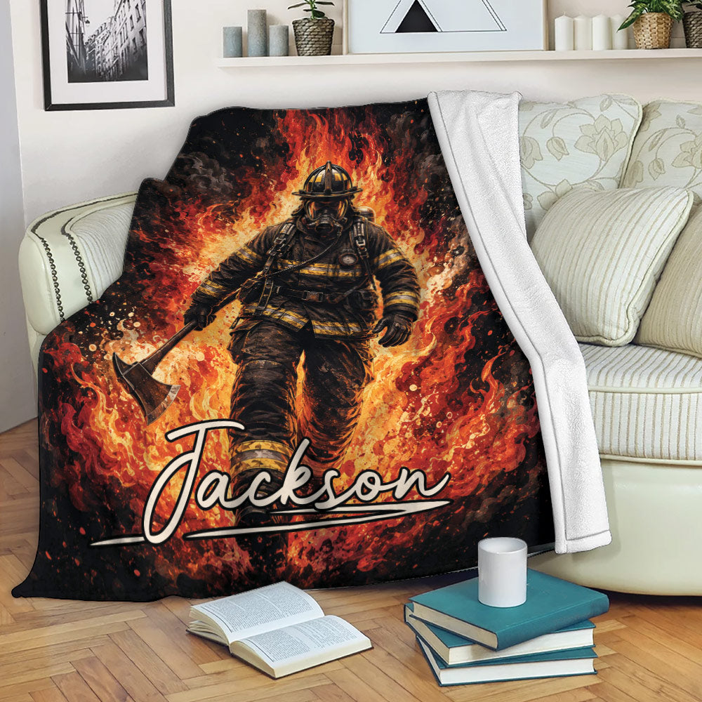 Firefighter throw blanket displayed on a sofa with bold flame artwork in black, red, orange, and yellow