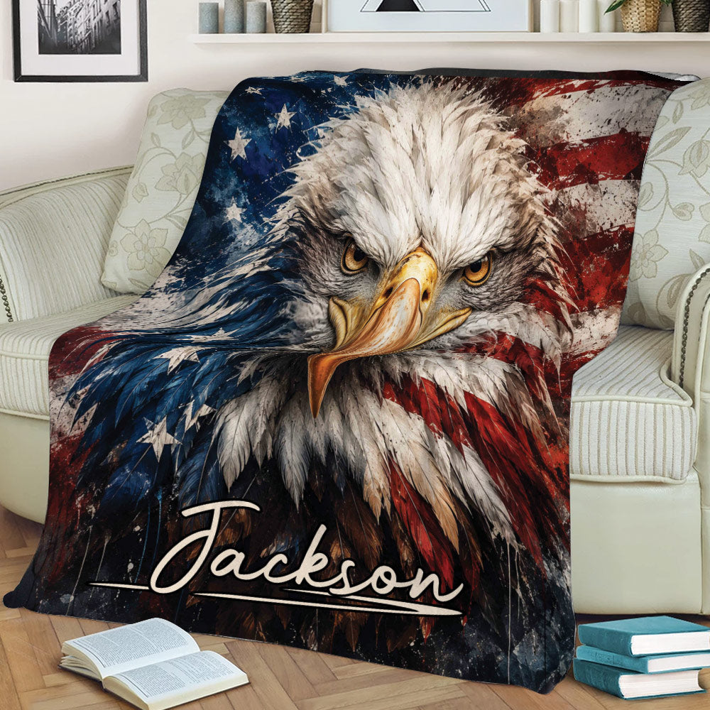 Patriotic eagle blanket draped over a couch, featuring detailed feathers and American flag colors