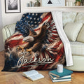 Patriotic eagle throw blanket displayed on a sofa with red, white, and blue wildlife artwork