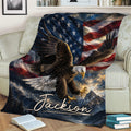Eagle throw blanket draped across a sofa, featuring American flag and mountain landscape artwork